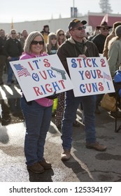 Coeur D'Alene, Idaho - January 19:Unidentified Couple Hold Signs During The Pro 2nd Amendment Rally In Coeur D'Alene, Idaho On January 19, 2013.