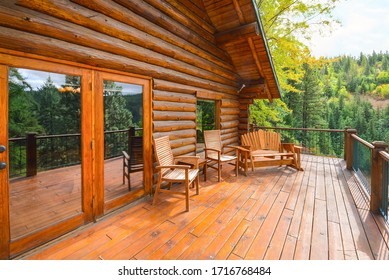 Coeur d'Alene, Idaho - September 21 2019: A large open wooden deck on a rustic log cabin home in the mountains of the American Northwest.