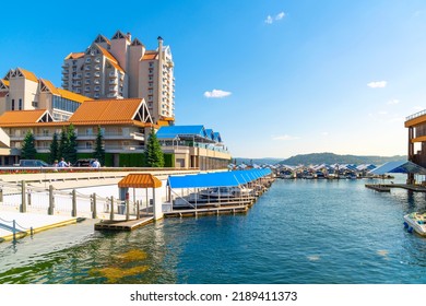 Coeur D'Alene, Idaho USA - August 5 2022: Summer View Of The Downtown Marina With Resort Buildings And Offices Nearby In The Rural Mountain Town Along The Lake In Coeur D'Alene, Idaho USA.