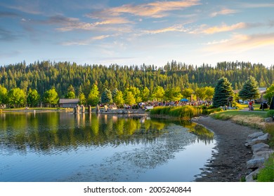 Coeur D'Alene, Idaho USA - July 8 2021: An Outdoor Free Concert At The Small Lake In The Public Riverstone Park At Sunset In Coeur D'Alene, Idaho, USA