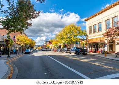 Coeur d'Alene, Idaho, USA - October 8 2021: Shops and cafes on Sherman Street in the lakeside downtown area of the rural mountain city of Coeur d'Alene at autumn.