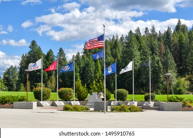 Coeur d'Alene, Idaho USA - September 1 2019: Flags of the United States Military Branches fly in the wind in McEuen Park, Coeur d'Alene, Idaho.