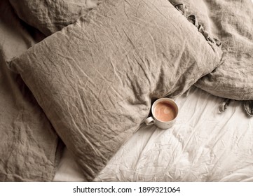 Coffe in bed. Linen bedsheets. - Shutterstock ID 1899321064