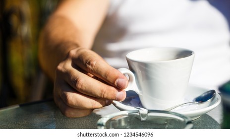 Coffe Time. Hand Of Man Hold Coffee Or Coffe Cup At Cafe In The Morning. Cup Of Coffee. Cappuccino And Black Espresso Coffe Cup. Coffee Drink. Close Up Of A Man Hands Holding A Hot Coffe Cups. Closeup