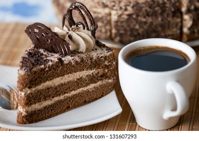 Coffee ,a Slice Of Cake On The Plate On The Background Of Cake