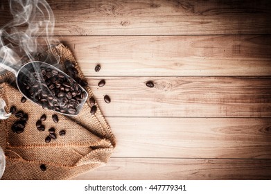 Coffee bean on grunge wooden background. Top view