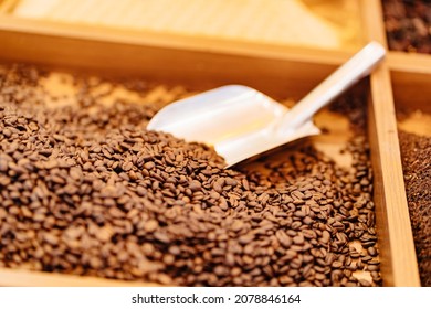 coffee bean spatula on the store counter. sale of coffee beans by weight. natural drinks.