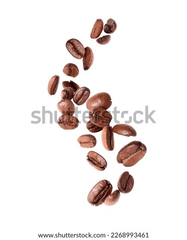 Coffee beans in the air close -up isolated on a white background