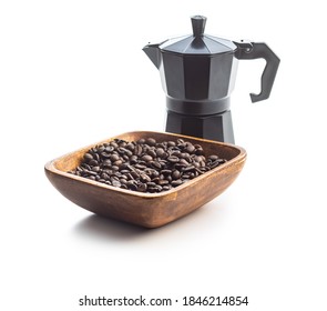 Coffee beans and bialetti coffee maker.  Moka pot isolated on white background.