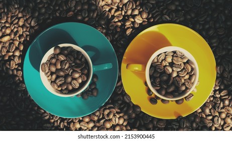 Coffee beans in blue and yellow cups