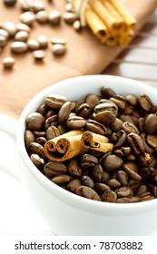 Coffee beans and ?innamon ?ticks in the cup