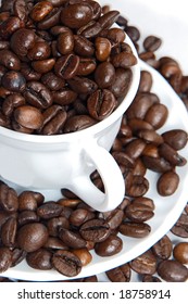 Coffee beans in a cup  - focus in the first plane -