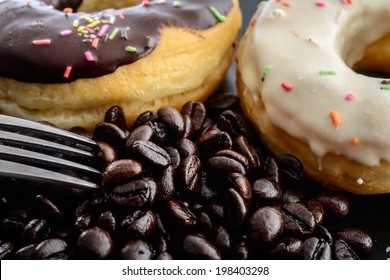 Coffee beans donuts milk donut Silver fork macro,Delicious chocolate milk donut close up cofee beans,Aromatherapy looking wake up when sleepy - Powered by Shutterstock