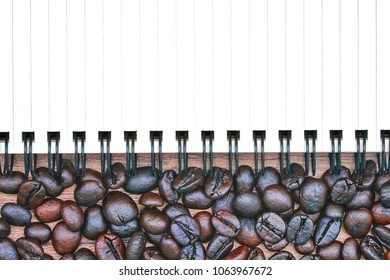 Coffee beans and empty note book isolated on wooden table desk with workspace. Copy space empty blank for text.
