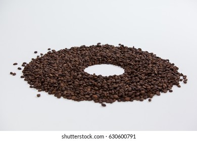 Coffee beans forming doughnut on white background - Powered by Shutterstock