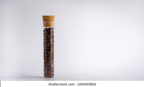 Coffee beans in a glass jar. Close up, isolated, white background.  - Powered by Shutterstock