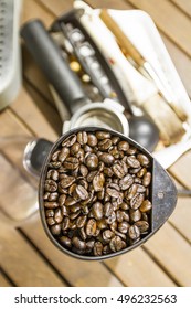 Coffee beans in the grinder machine.