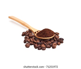 Coffee Beans And Ground Coffee In A Spoon.