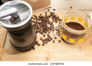 Coffee Beans Hand Grinder And Beans On Table