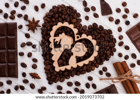 Coffee beans in heart shape and chocolate.
