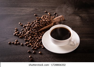 Coffee Beans And Hot Coffee On The Table