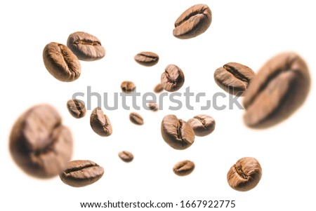 Coffee beans levitate on a white background