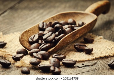 Coffee Beans In An Old Wooden Scoop