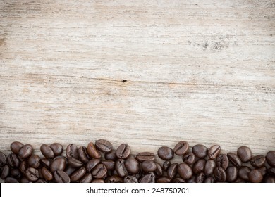 Coffee Beans On Grain Wood Background