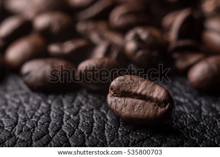 Coffee beans on the leather surface, makro pgotography, cafe concept