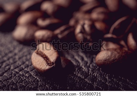 Coffee beans on the leather surface, makro pgotography, cafe concept