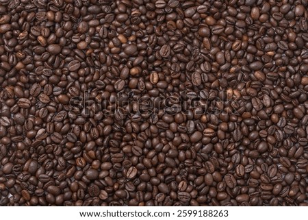 Coffee beans on the surface. Coffee as a background. Top view. Flatlay