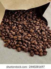 coffee beans are on table after roasting. Fresh converted coffee beans before packing in paper bag. Ground coffee for making Americano or cappuccino. grain cultivation and harvesting