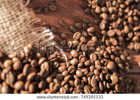 coffee beans on a table with burlap.