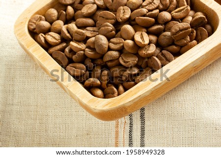 coffee beans on wooden plate