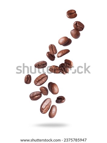 Coffee beans scattered in the air isolated on a white background. Falling coffee beans on white space