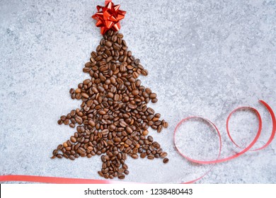 Coffee beans in the shape of a Christmas tree lie on a marble surface - a cozy coffee on Christmas to spend the contemplative time in the warm and to get the soul recovery - coffee beans as a perfect  - Powered by Shutterstock