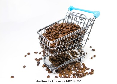 Coffee Beans In Shopping Cart On White Background. Coffee Purchasing. Price Of Coffee. 