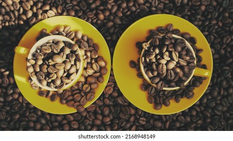 Coffee beans in two yellow cups