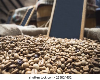 Coffee Beans Unroasted With Blank Chalkboard Sign