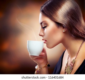 Coffee. Beautiful Girl Drinking Tea Or Coffee. Cup Of Hot Beverage