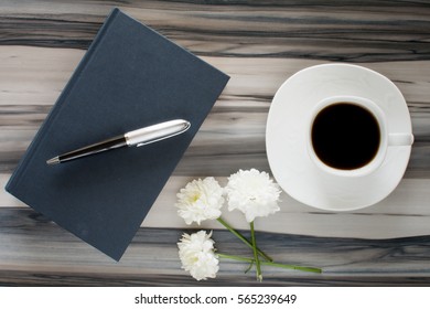 coffee and book on table