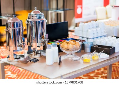 Coffee, Bottles Of Milk, Cups On Catering Table At Conference. Group Of Empty White Ceramic Cups For Coffee Or Tea In Outside Buffet At The Business Meeting Event Or Hotel.