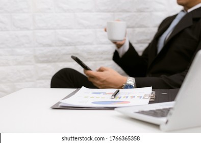 Coffee Break Businessman Executive Working Relax On Laptop At His Desk.