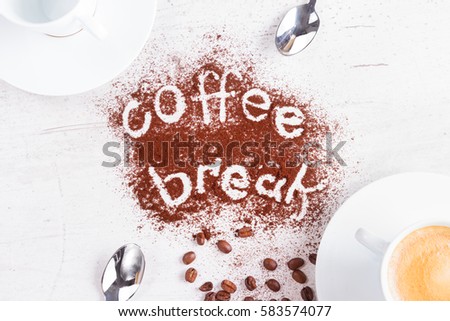 coffee break concept - cups of espresso, spoons and coffee break lettering