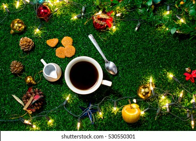 Coffee Break And Mini Cookies In Christmas Day On Green Grass. Morning Sunshine Day And Good Day. Happy Time Together In Winter Season.Top View