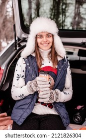 Coffee Break In Winter Park. Pause In Study Outside The City. Out In Nature In Winter.  Girl Driver . Winter Quarantine .
Young Girl Went Out Of Town By Car For A Picnic In Winter.
