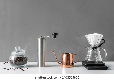 Coffee Brewing Tools In Modern Style For Homemade On White Table And Grey Background With Copy Space From Home Kitchen.