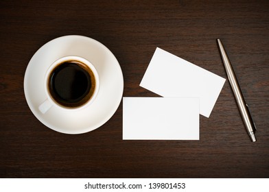 Coffee, Business Card And Pen On Wooden Table