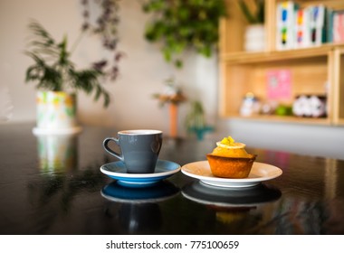 Coffee and a Cake on Black Table