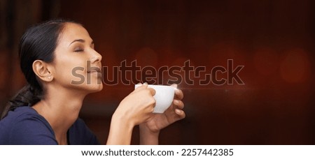 Coffee, calm and woman smelling the aroma in a studio with mockup space for advertising or marketing. Peace, relax and female model from Mexico enjoying the scent of a cappucino by maroon background.
